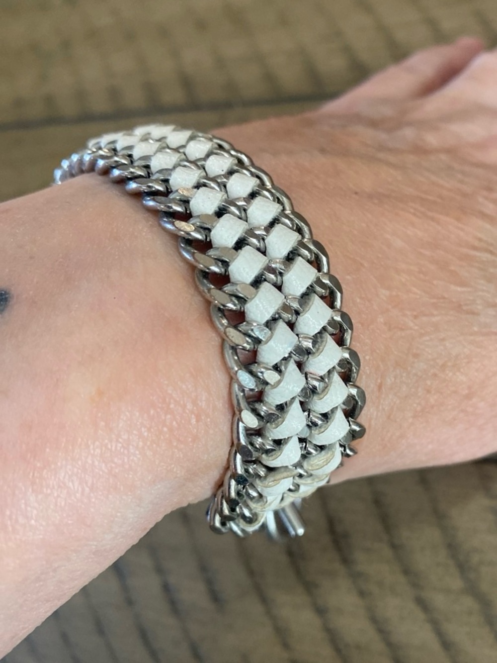 Silver tone  and white leather chain bracelet